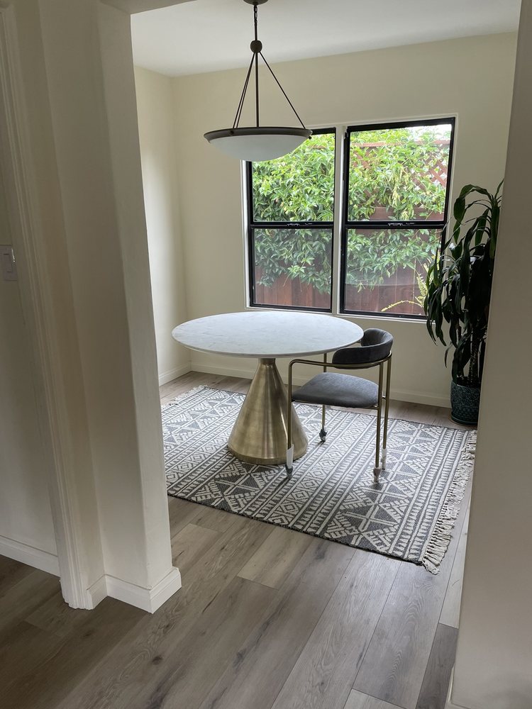 Marble pedestal dining table and chair fully assembled in a customer's home